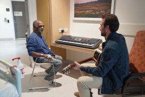Brian and Jake jamming in Brian's hospital room