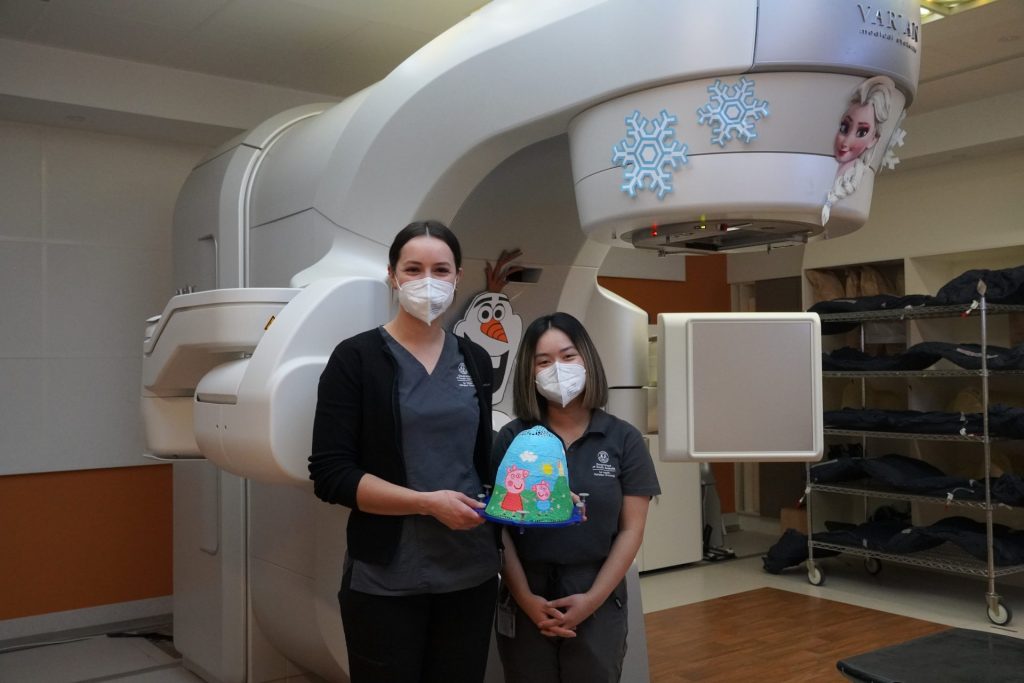 Radiation therapists with painted masks