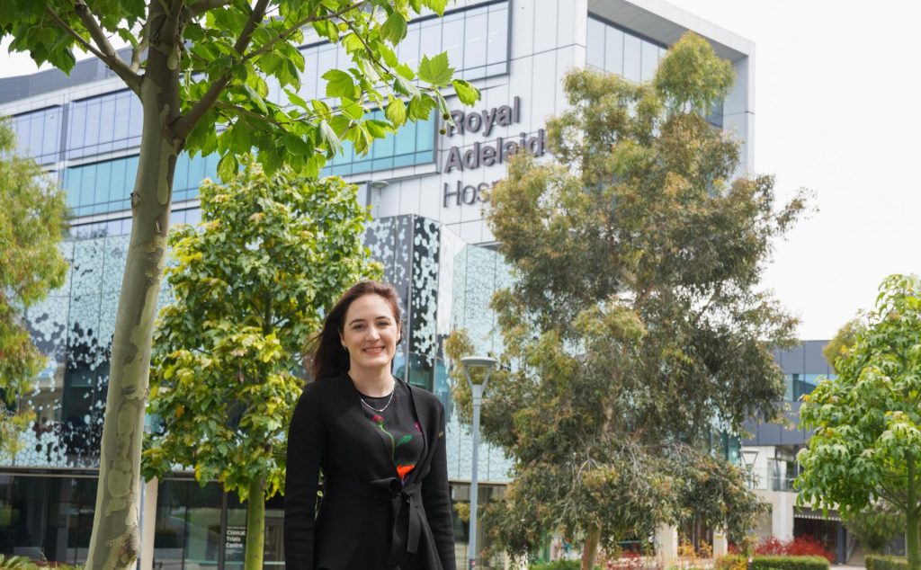 Researcher Dr Georgina Irish standing in front of Royal Adelaide Hospital